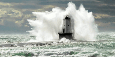 Lighthouse with breaking waves