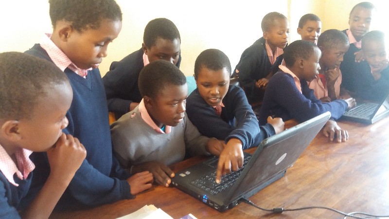 Chome pupils using laptops